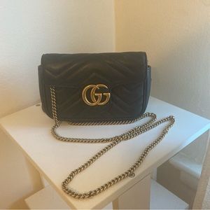 Gucci mini black purse, authenticated by TheRealReal. Tags and box included
